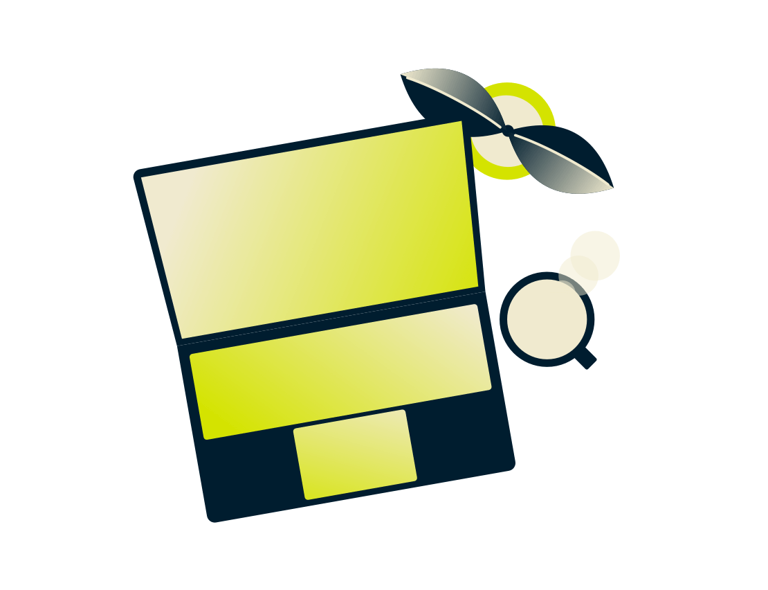 Laptop med en plante og drikke.